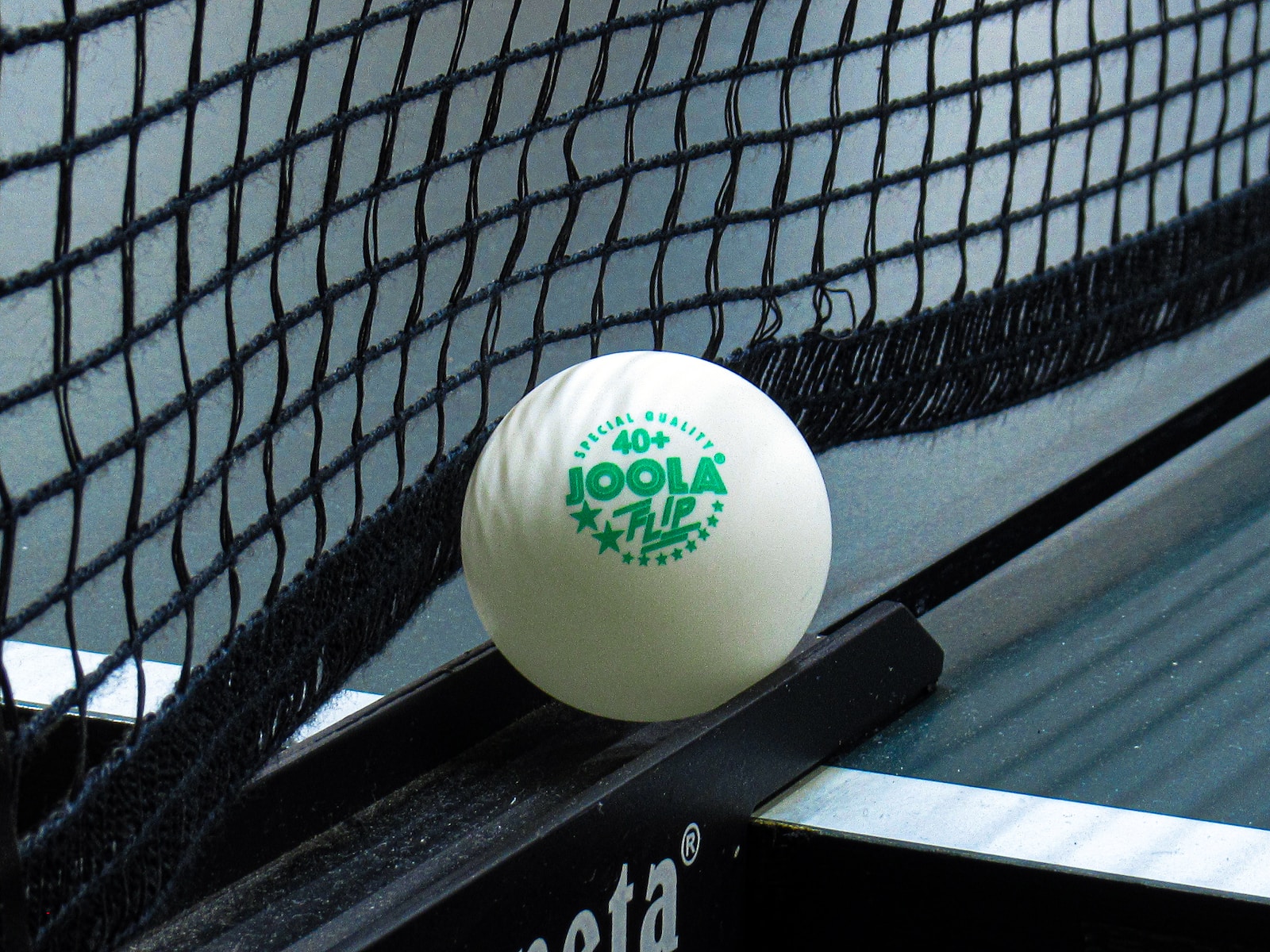 white golf ball on black and white textile